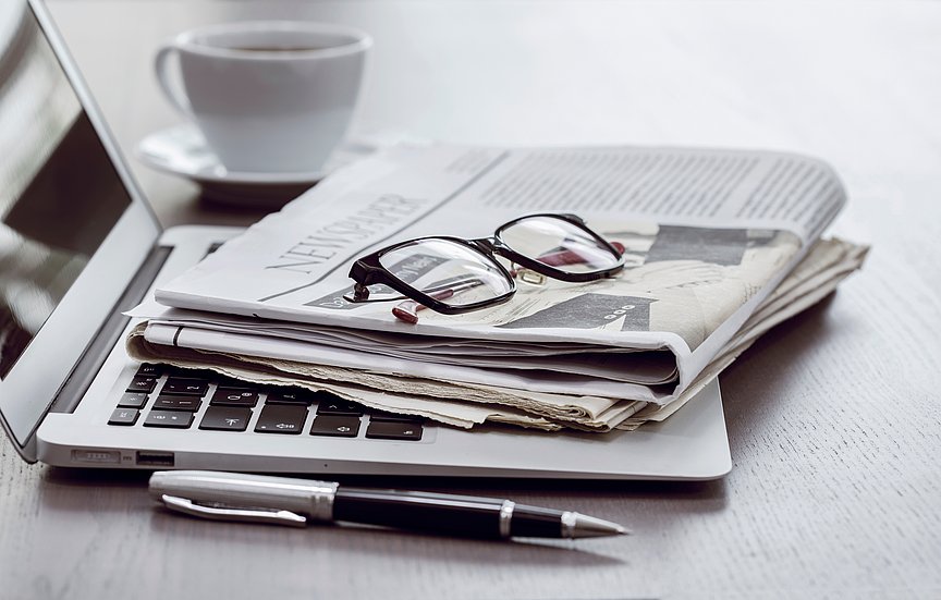 Press Newspaper and laptop