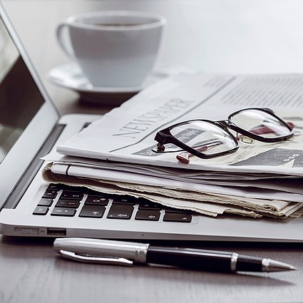 Newspaper and laptop 0